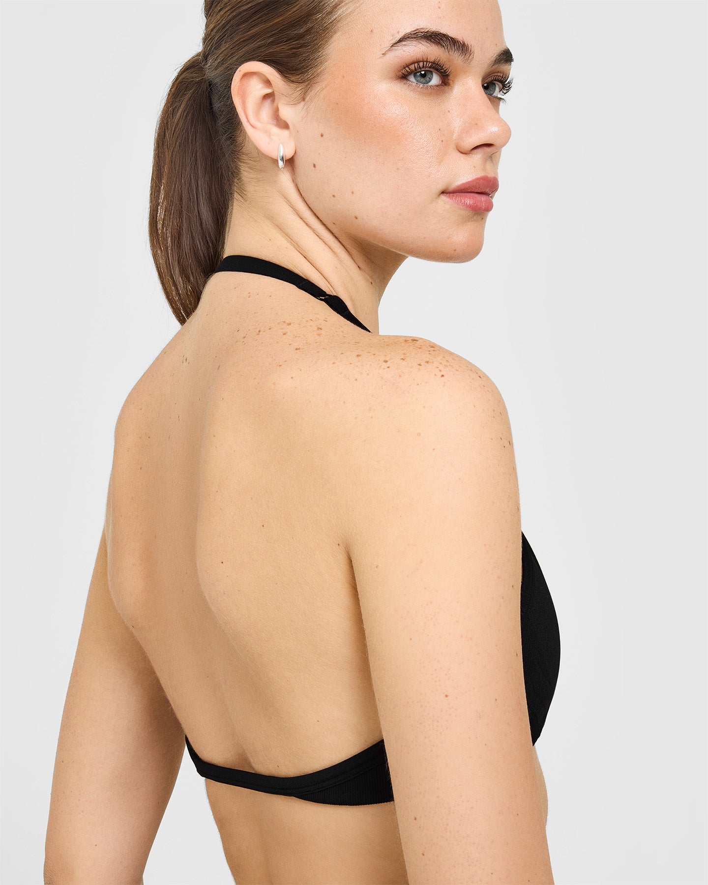 EnhanceLift Seamless Minimal Halter Neck Bralette with White Logo | Black - Image 4