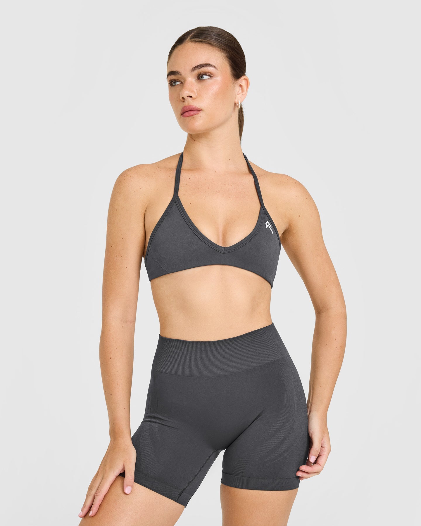 EnhanceLift Seamless Minimal Halter Neck Bralette with White Logo | Coal