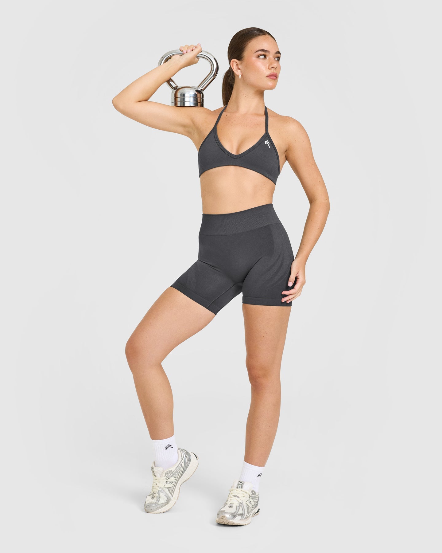 EnhanceLift Seamless Minimal Halter Neck Bralette with White Logo | Coal - Image 3