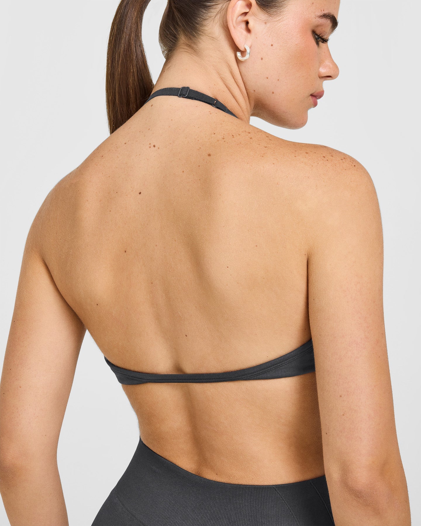 EnhanceLift Seamless Minimal Halter Neck Bralette with White Logo | Coal - Image 4