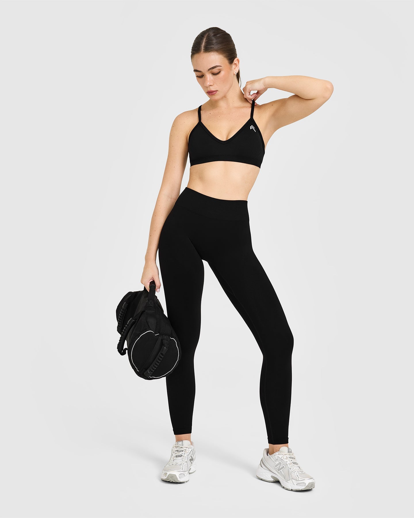 EnhanceLift Seamless Strappy Sports Bra with White Logo | Black - Image 3
