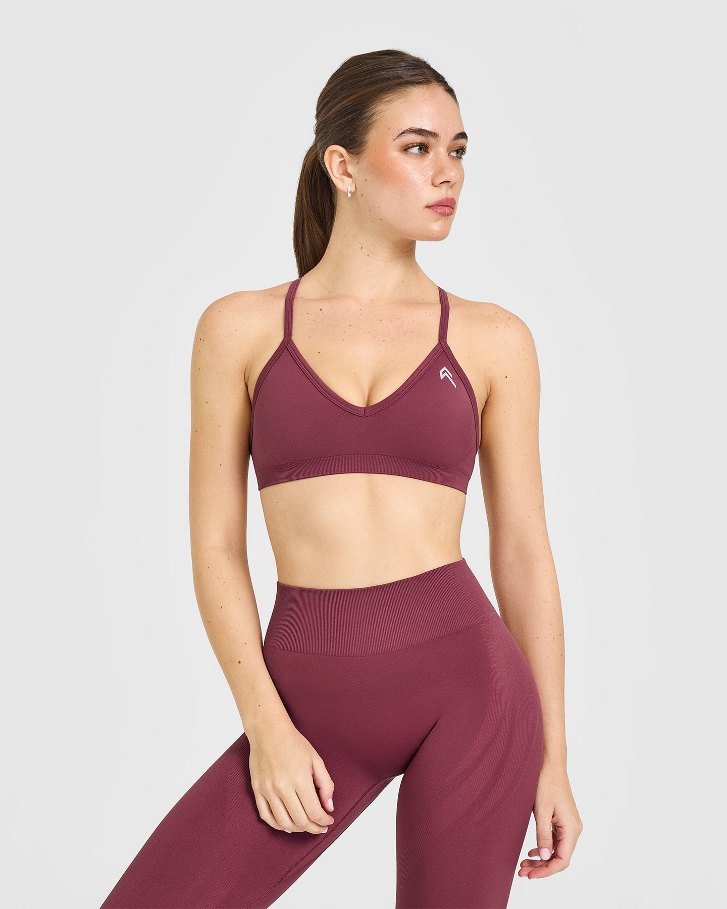 EnhanceLift Seamless Strappy Sports Bra with White Logo | Burnt Maroon
