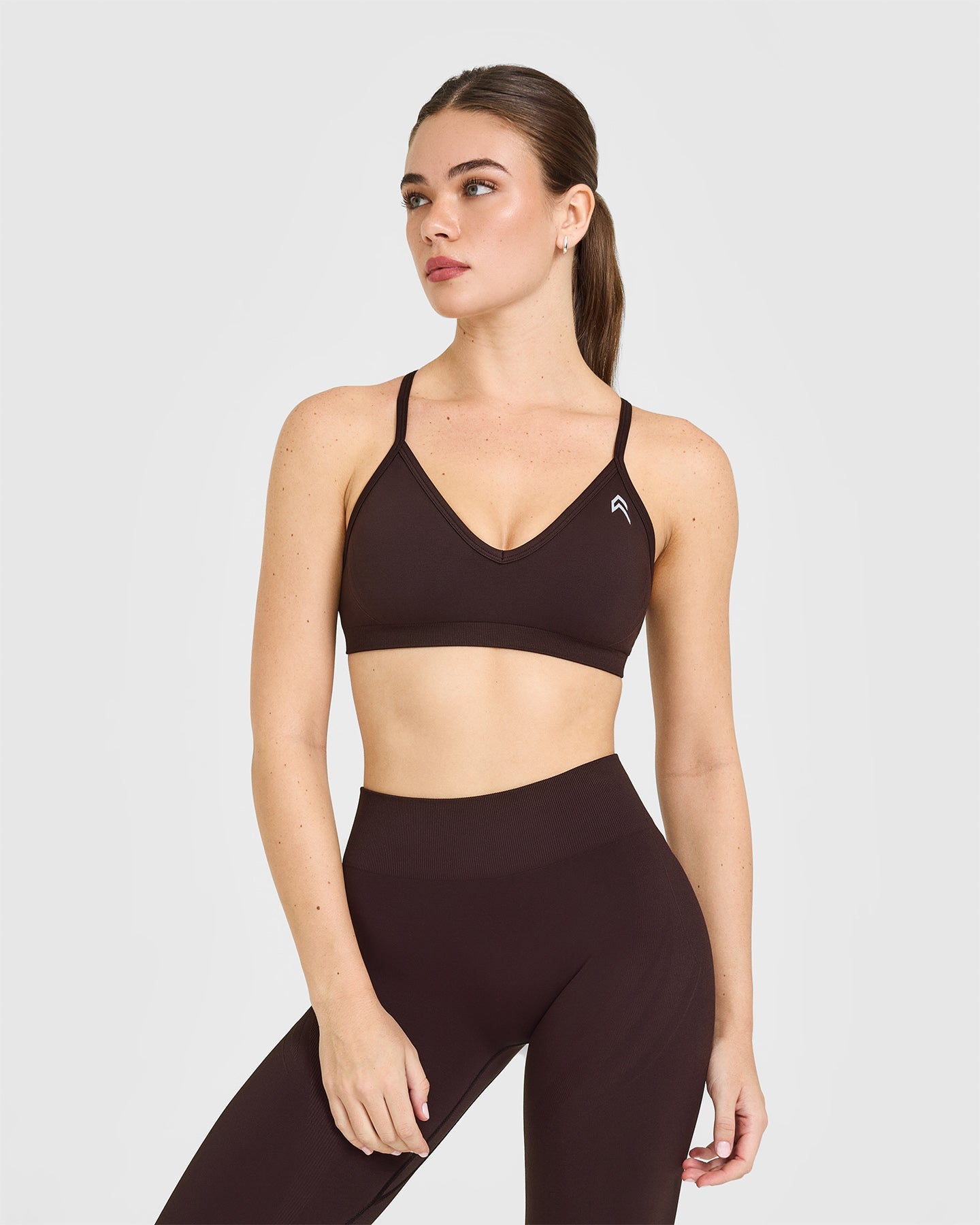 EnhanceLift Seamless Strappy Sports Bra with White Logo | Plum Brown