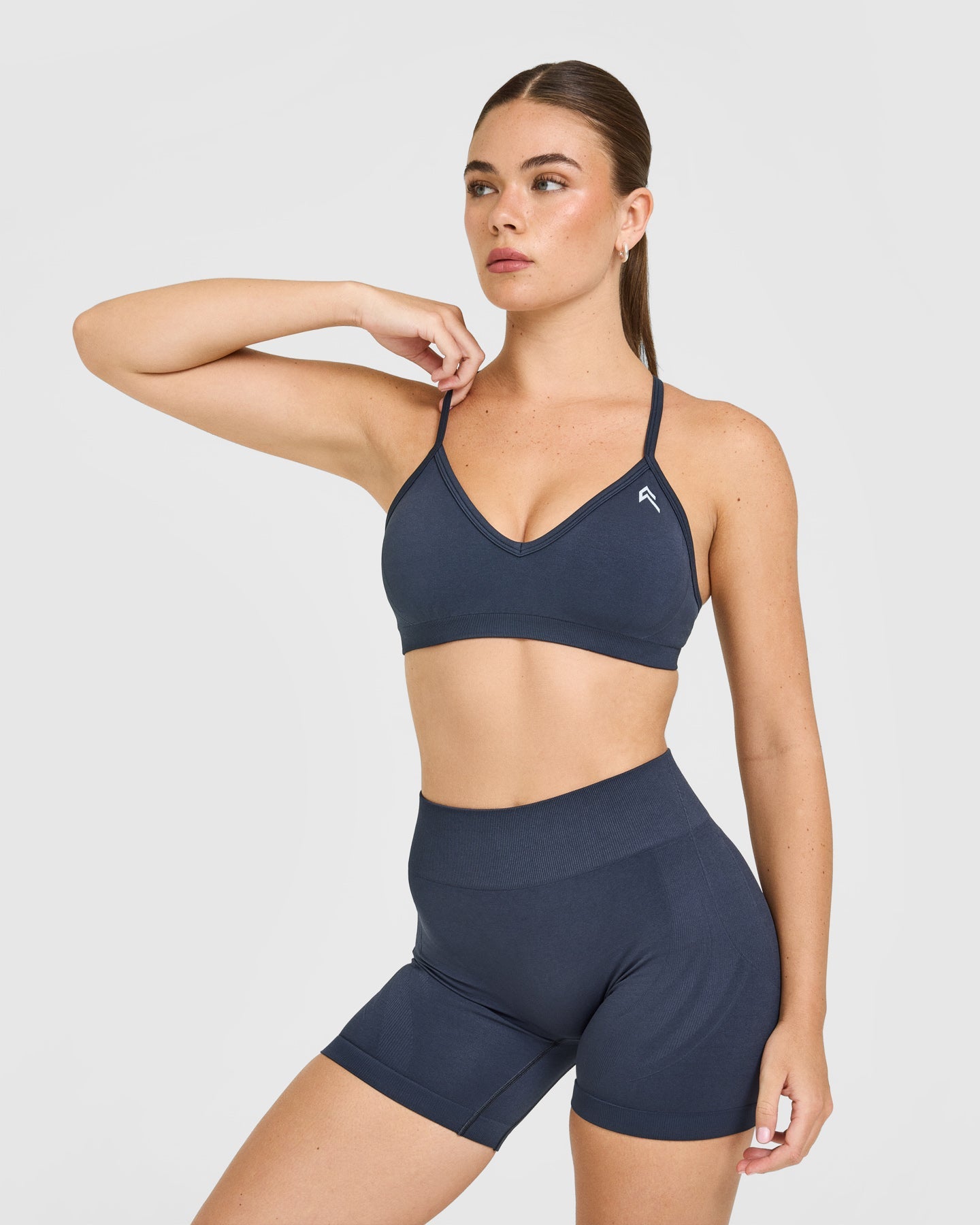 EnhanceLift Seamless Strappy Sports Bra with White Logo | True Blue