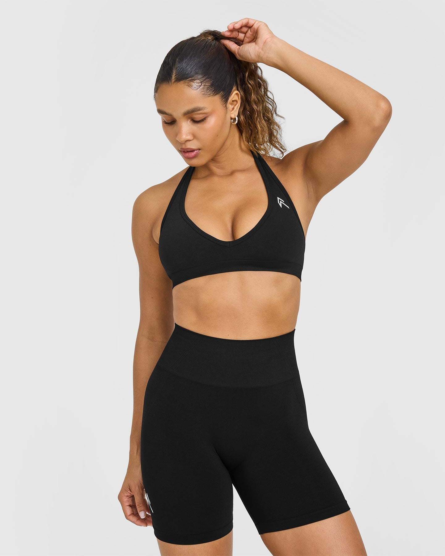 EffortlessLift Seamless Halter Neck Sports Bra with White Logo | Black