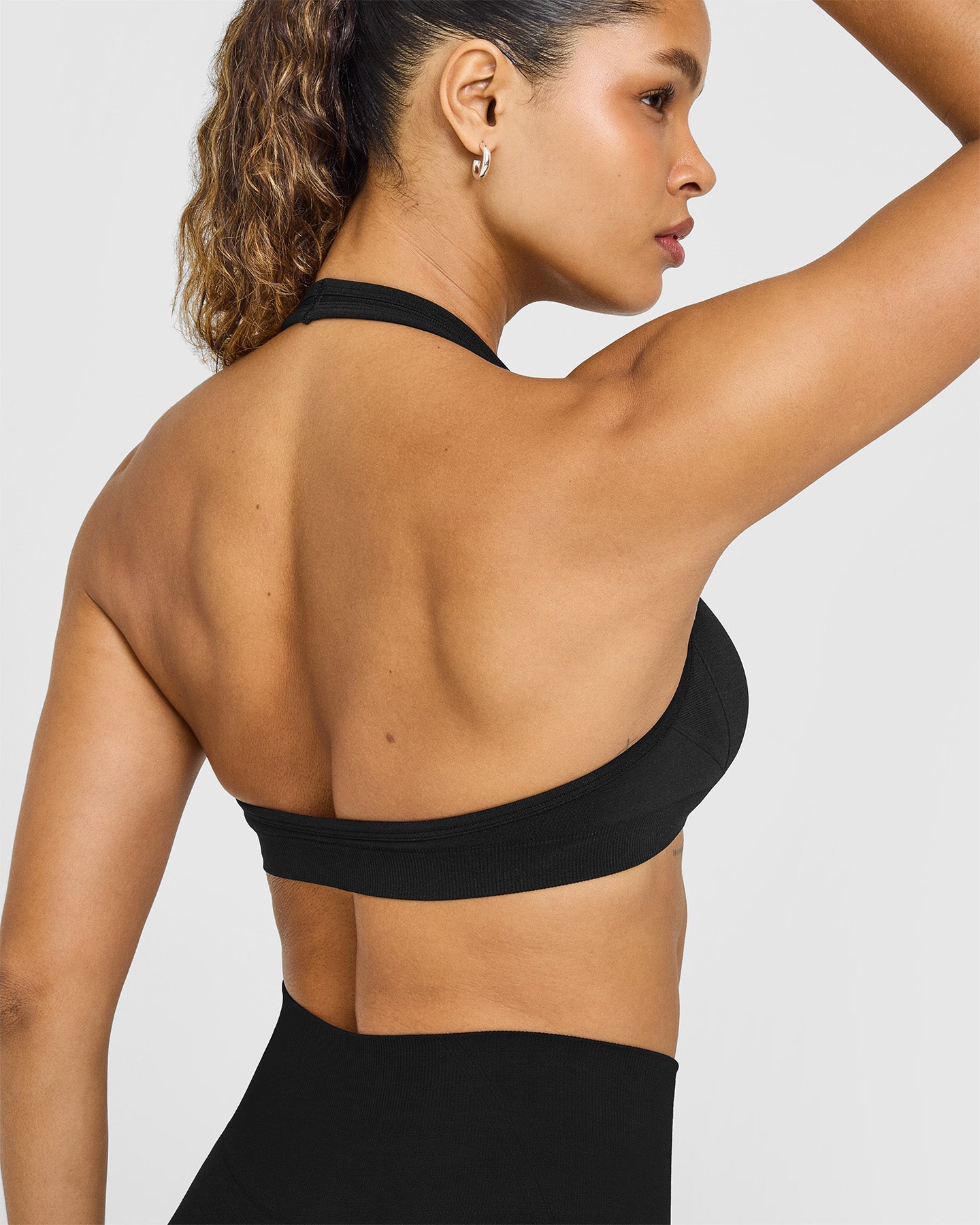 EffortlessLift Seamless Halter Neck Sports Bra with White Logo | Black - Image 4