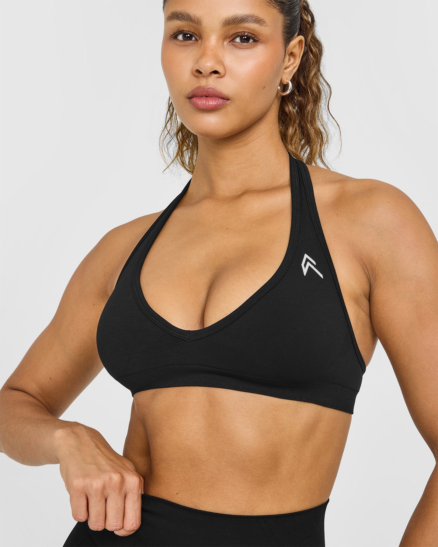 EffortlessLift Seamless Halter Neck Sports Bra with White Logo | Black - Image 5