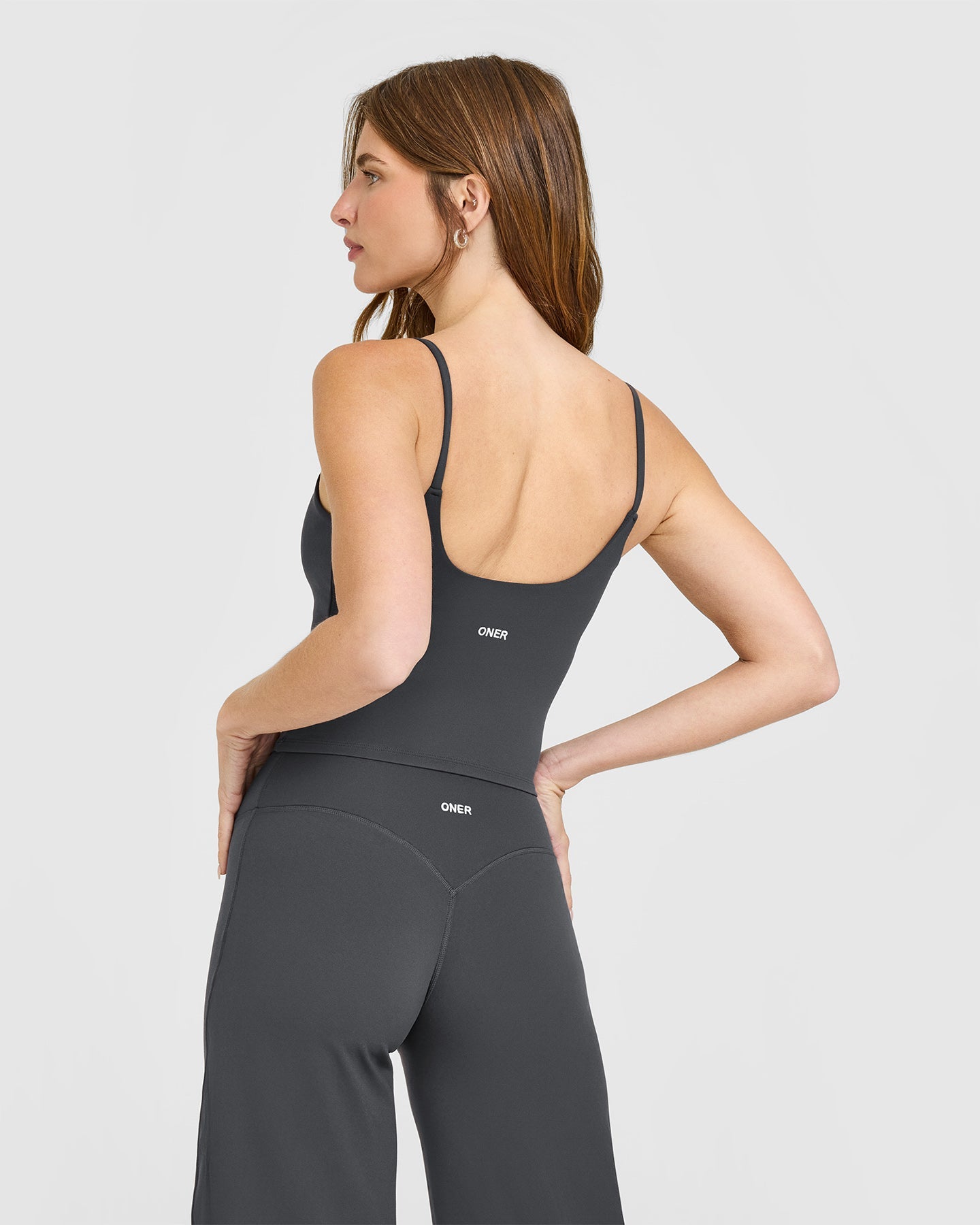 Alternative view of SoftMotion Strappy Mid Vest with Built in Bra Shelf with White Logo | Coal