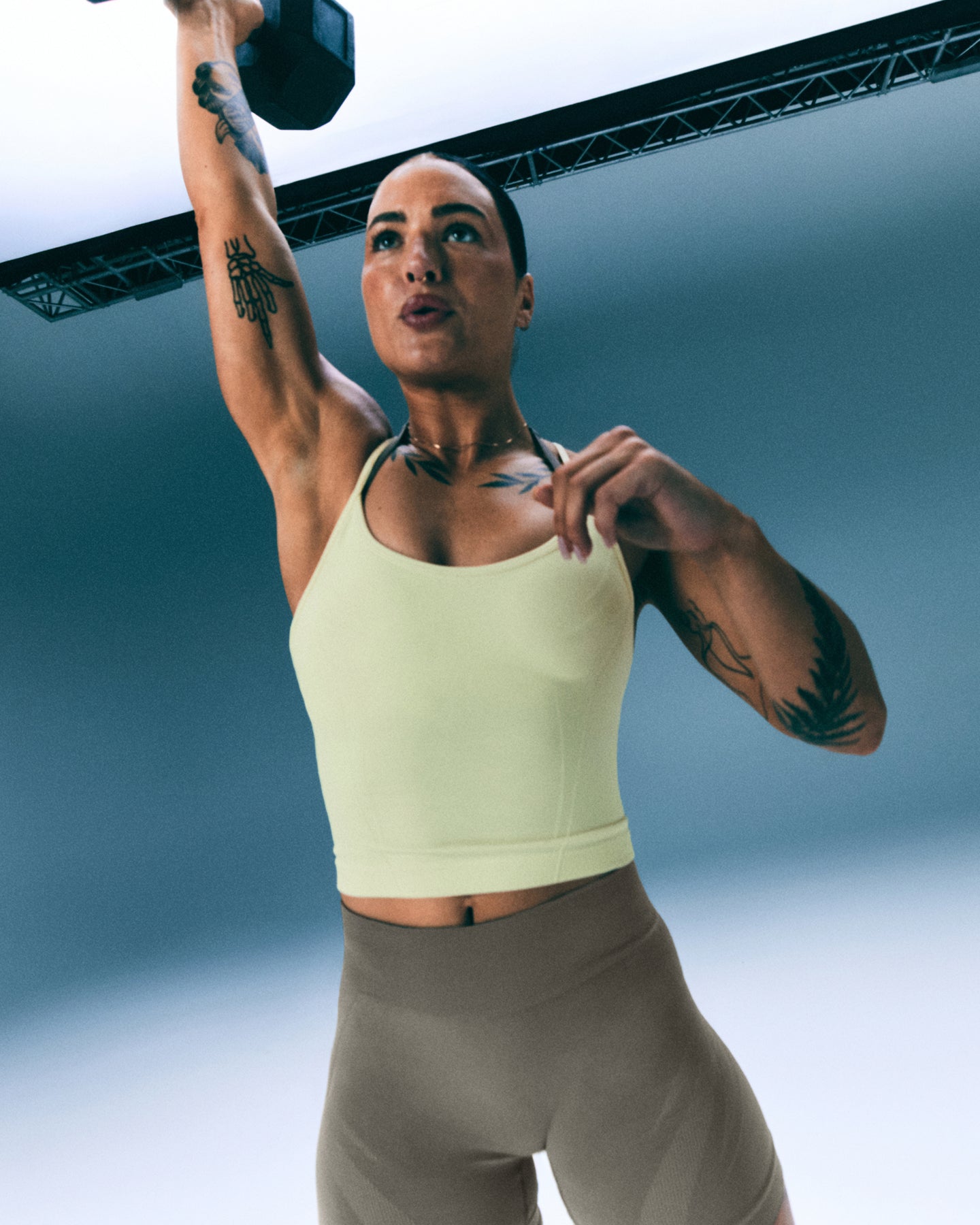 Alternative view of EnhanceLift Seamless Strappy Racer Vest with Built in Bra Shelf with Grey Logo | Pastel Yellow
