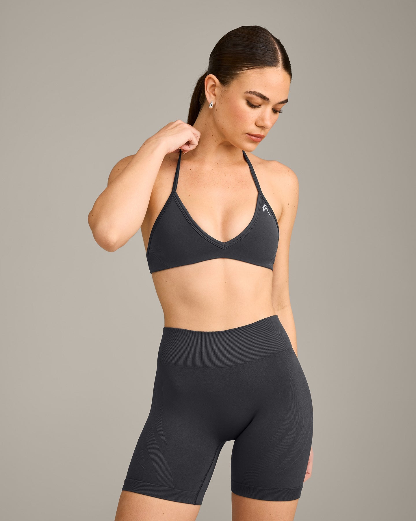 EnhanceLift Seamless Minimal Halter Neck Bralette with Grey Logo | Coal