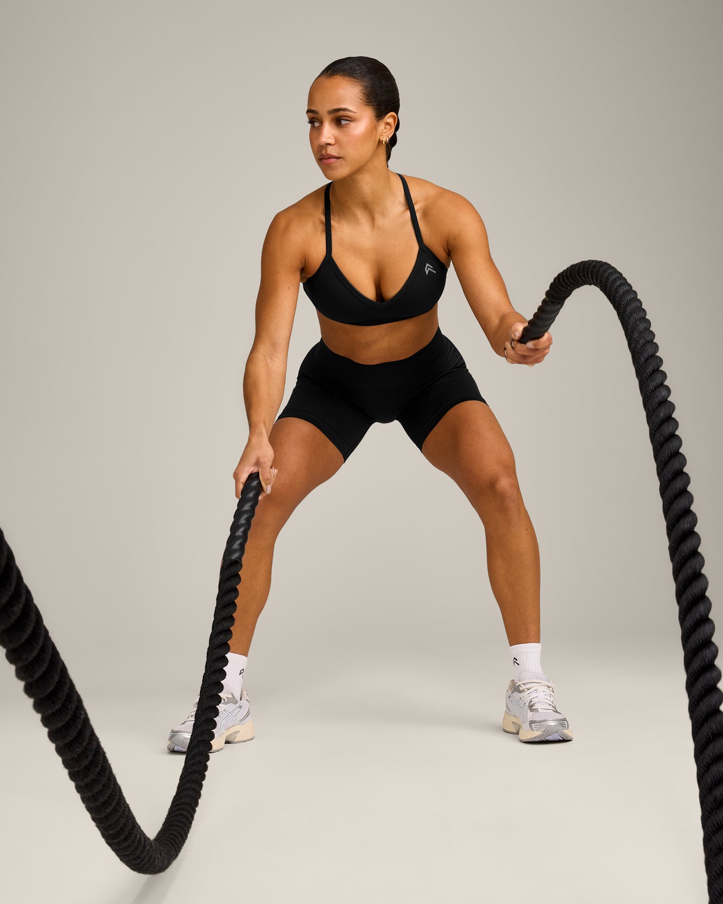 EnhanceLift Seamless Strappy Sports Bra with Grey Logo | Black - Image 3
