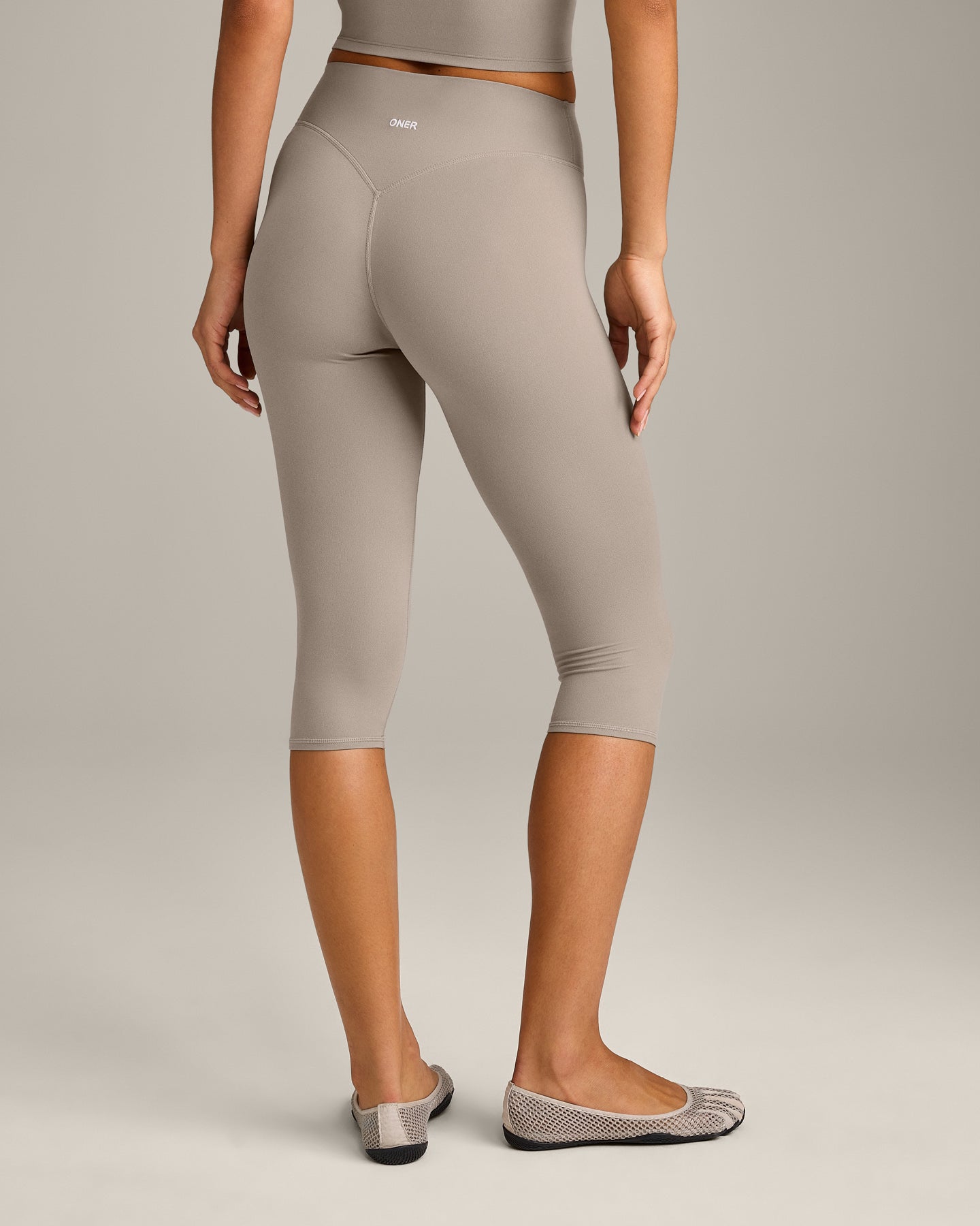 SoftMotion High Waisted Capri Leggings with White Logo | Warm Sand