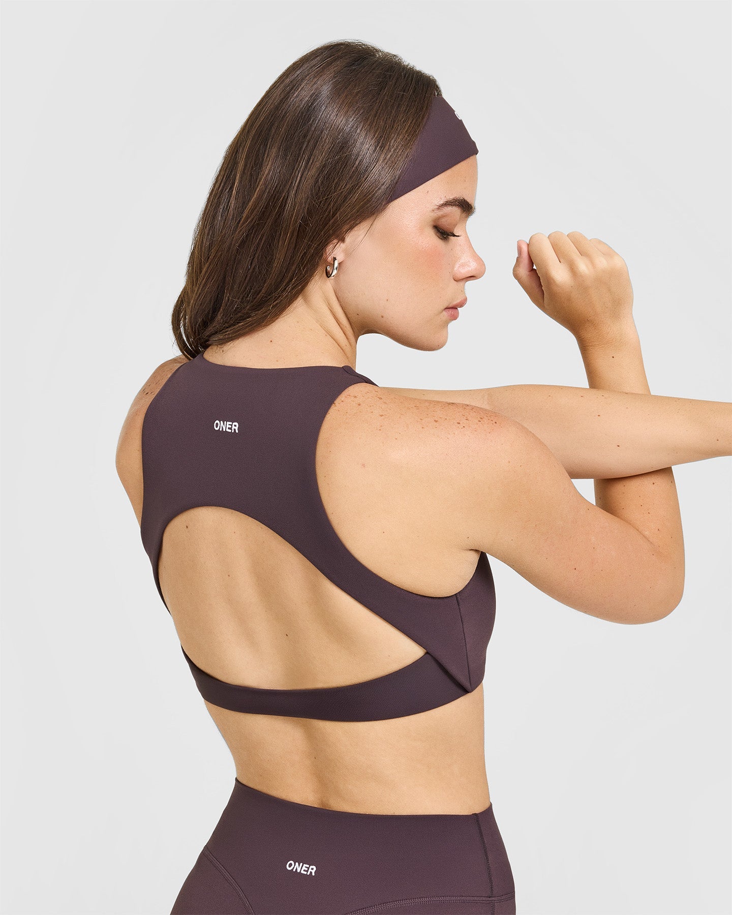 SoftMotion High Neck Sports Bra with White Logo | Dark Umber Brown - Image 4