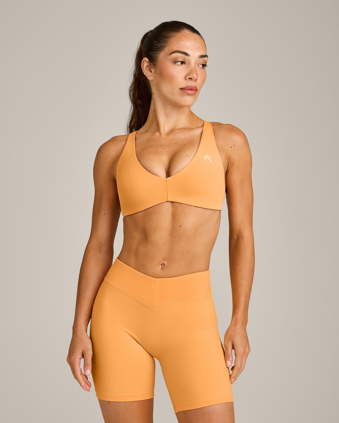 UnifiedMove Cross Back Sports Bra with Reflective Logo | Powdered Orange