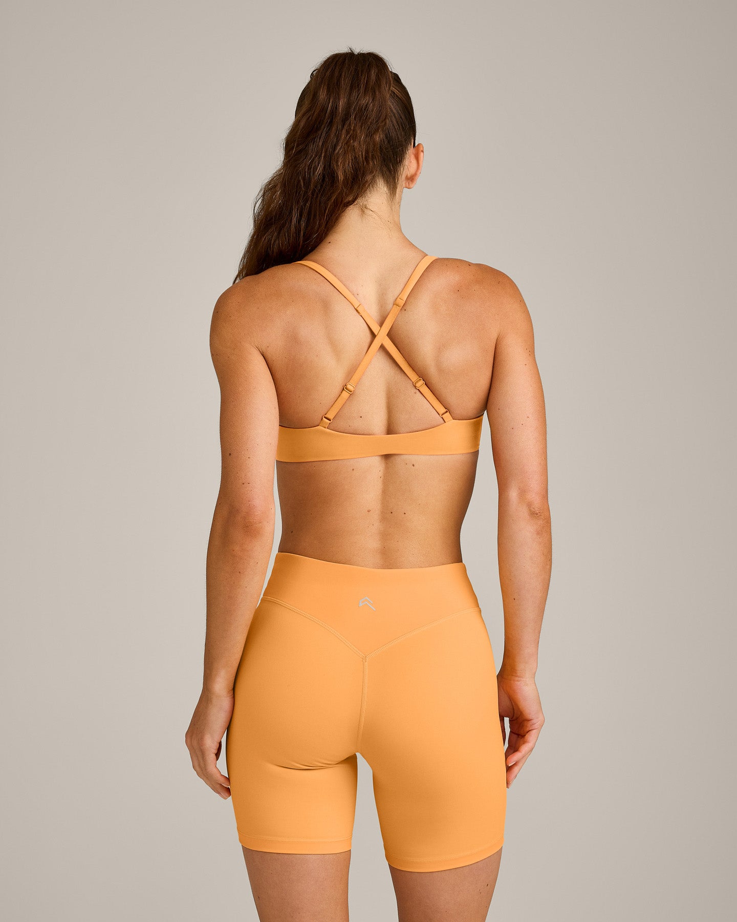 Alternative view of UnifiedMove Cross Back Sports Bra with Reflective Logo | Powdered Orange