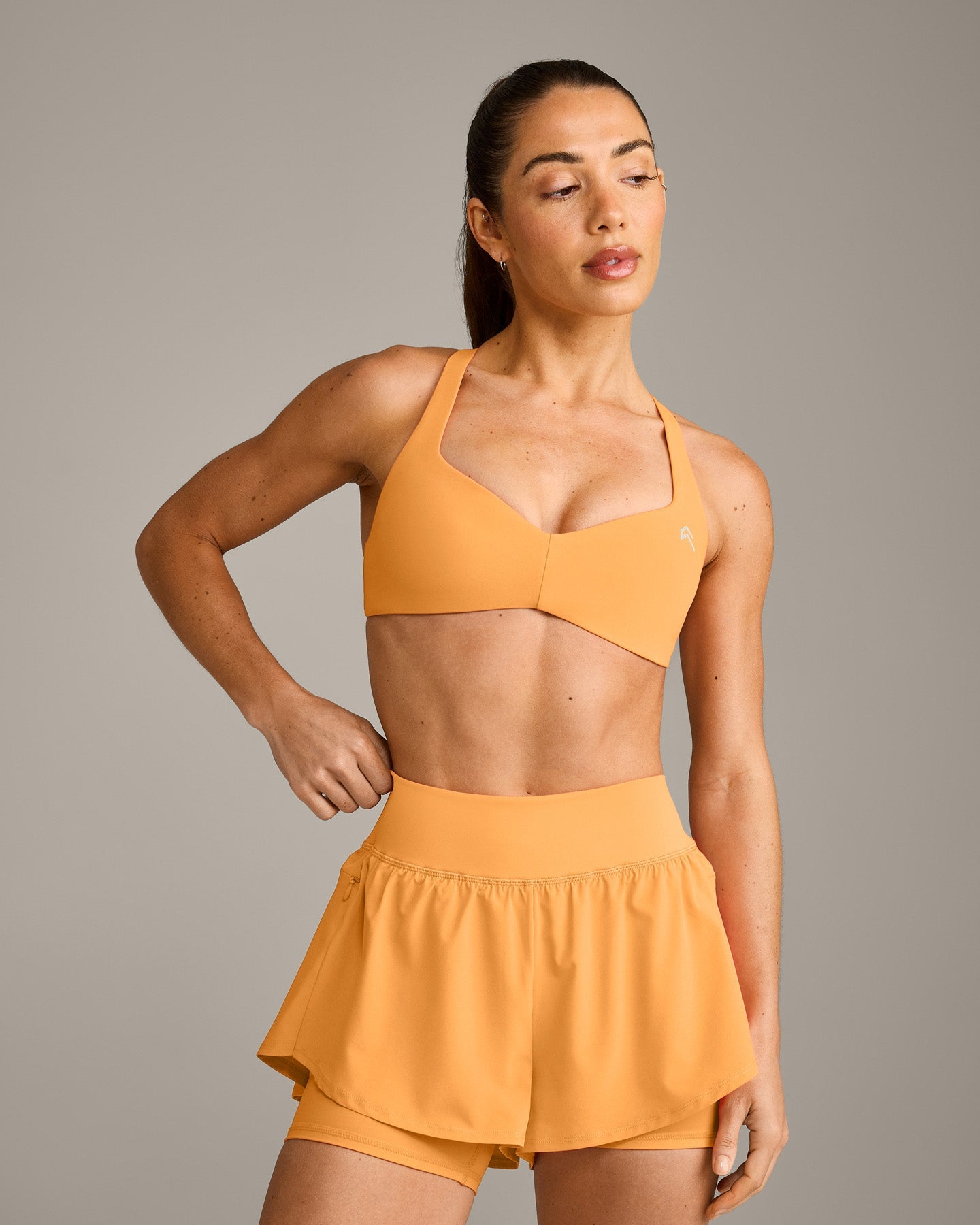 UnifiedMove T Back Minimal Bralette with Reflective Logo | Powdered Orange