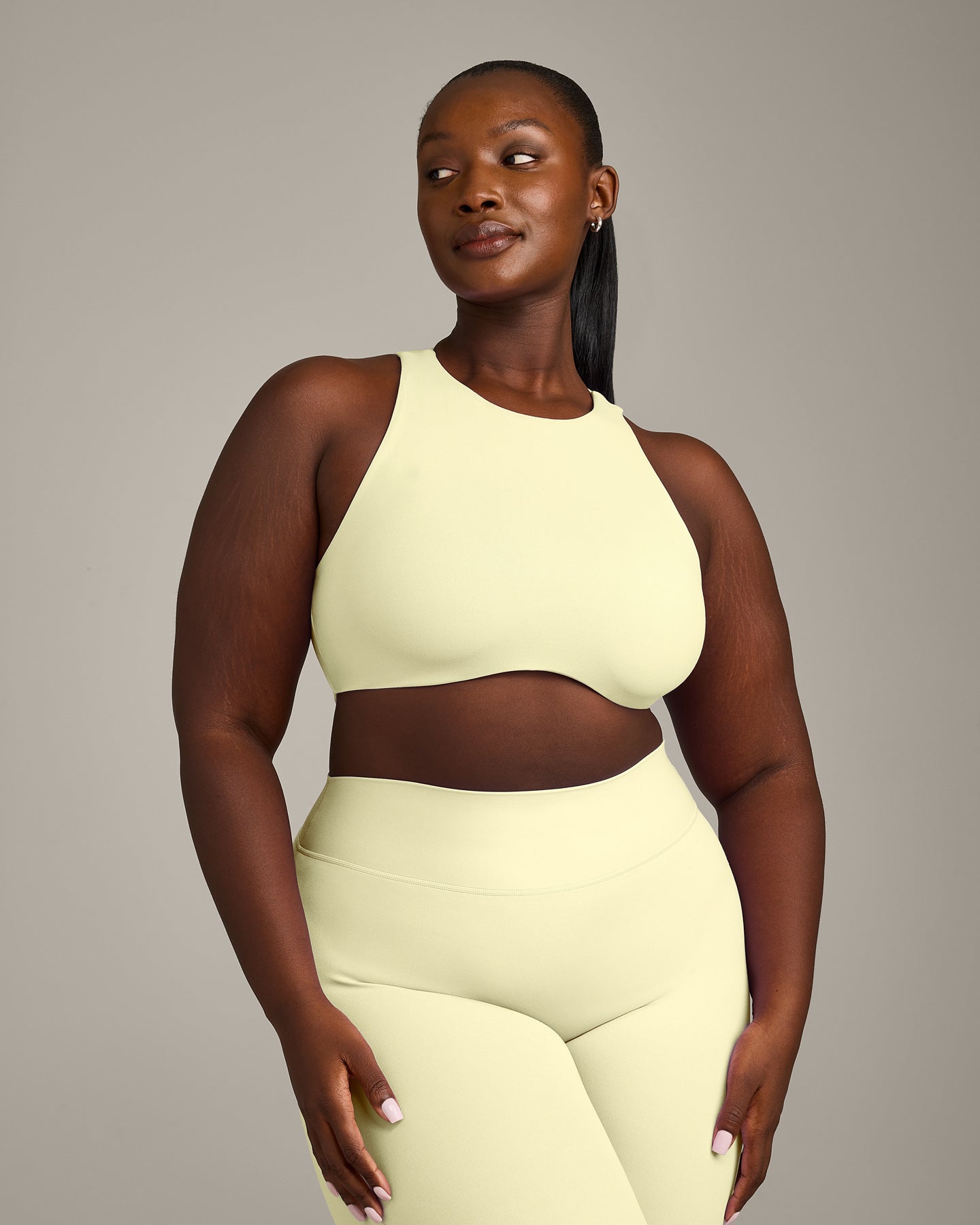 SoftMotion High Neck Sports Bra with Grey Logo | Pastel Yellow