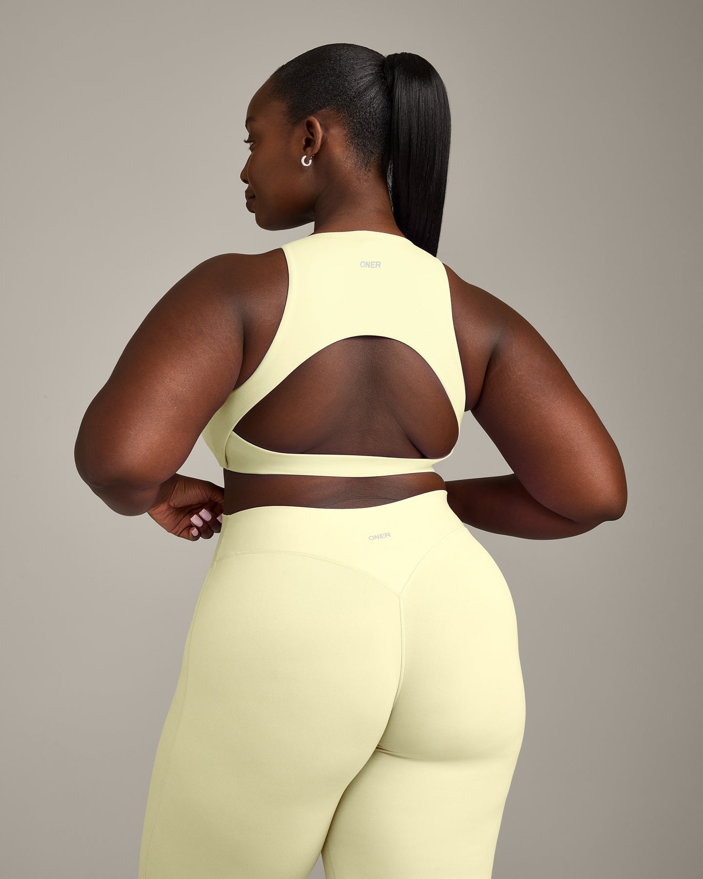 SoftMotion High Neck Sports Bra with Grey Logo | Pastel Yellow - Image 6