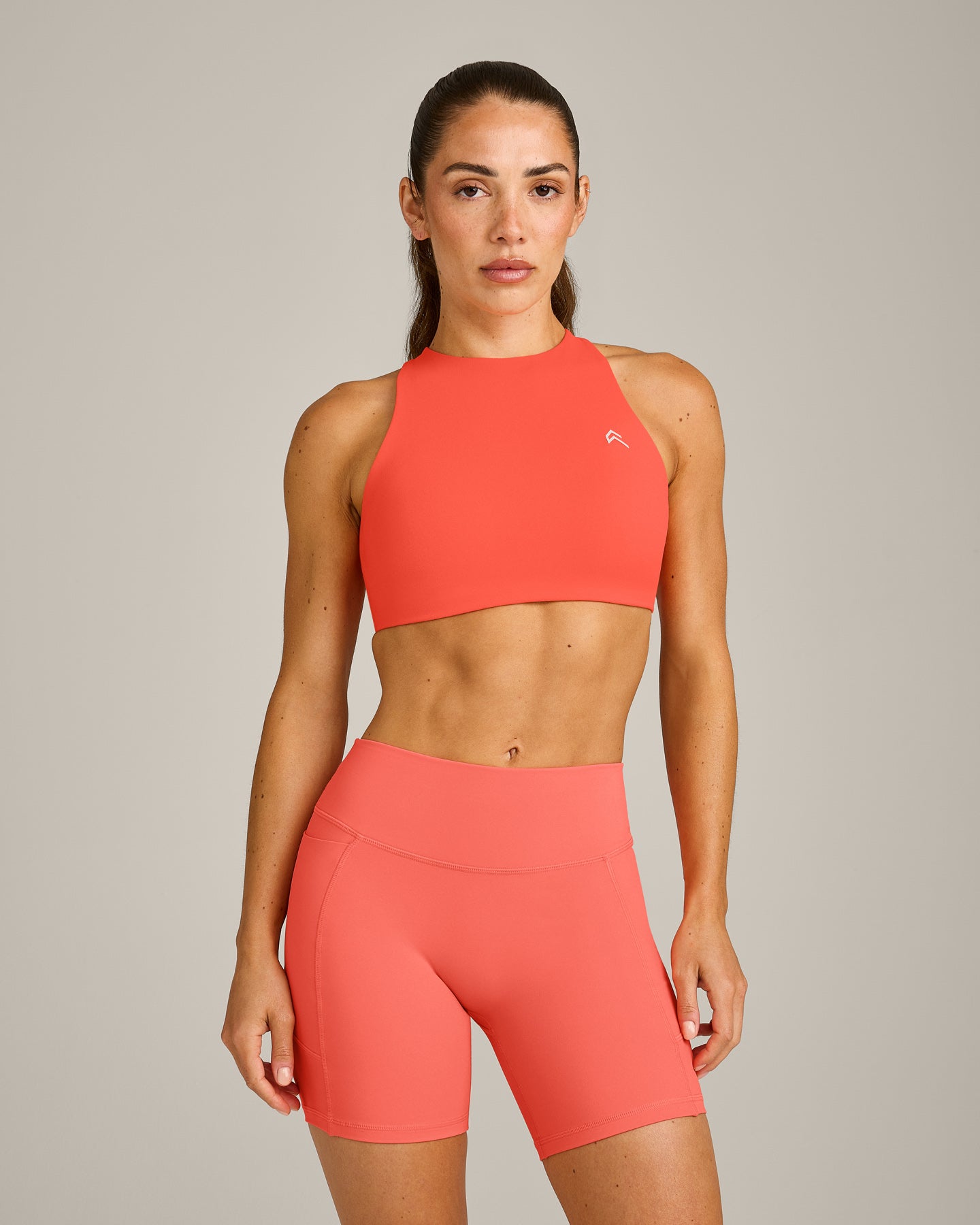 EasyLift High Neck Sports Bra with Grey Logo | Hyper Orange