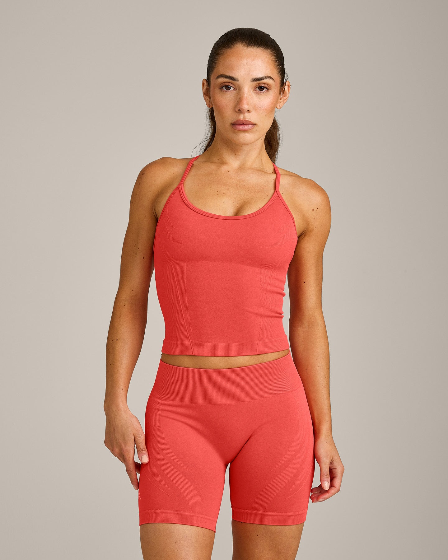 EnhanceLift Seamless Strappy Racer Vest with Built in Bra Shelf with Grey Logo | Dark Charged Coral
