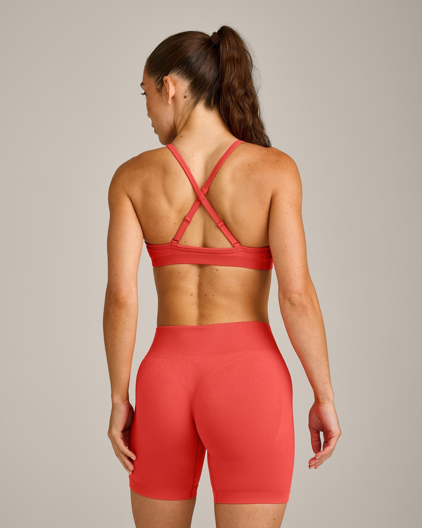 EnhanceLift Seamless Strappy Sports Bra with Grey Logo | Dark Charged Coral - Image 6