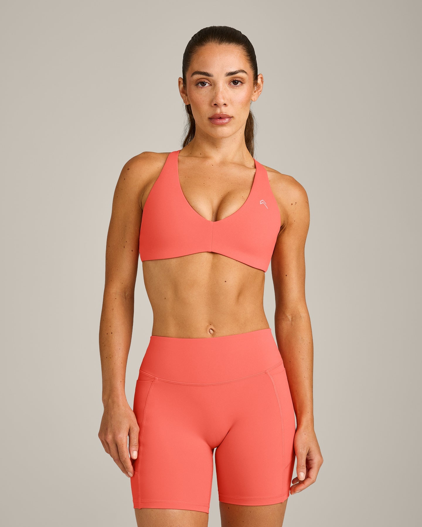 UnifiedMove Cross Back Sports Bra with Reflective Logo | Light Charged Coral