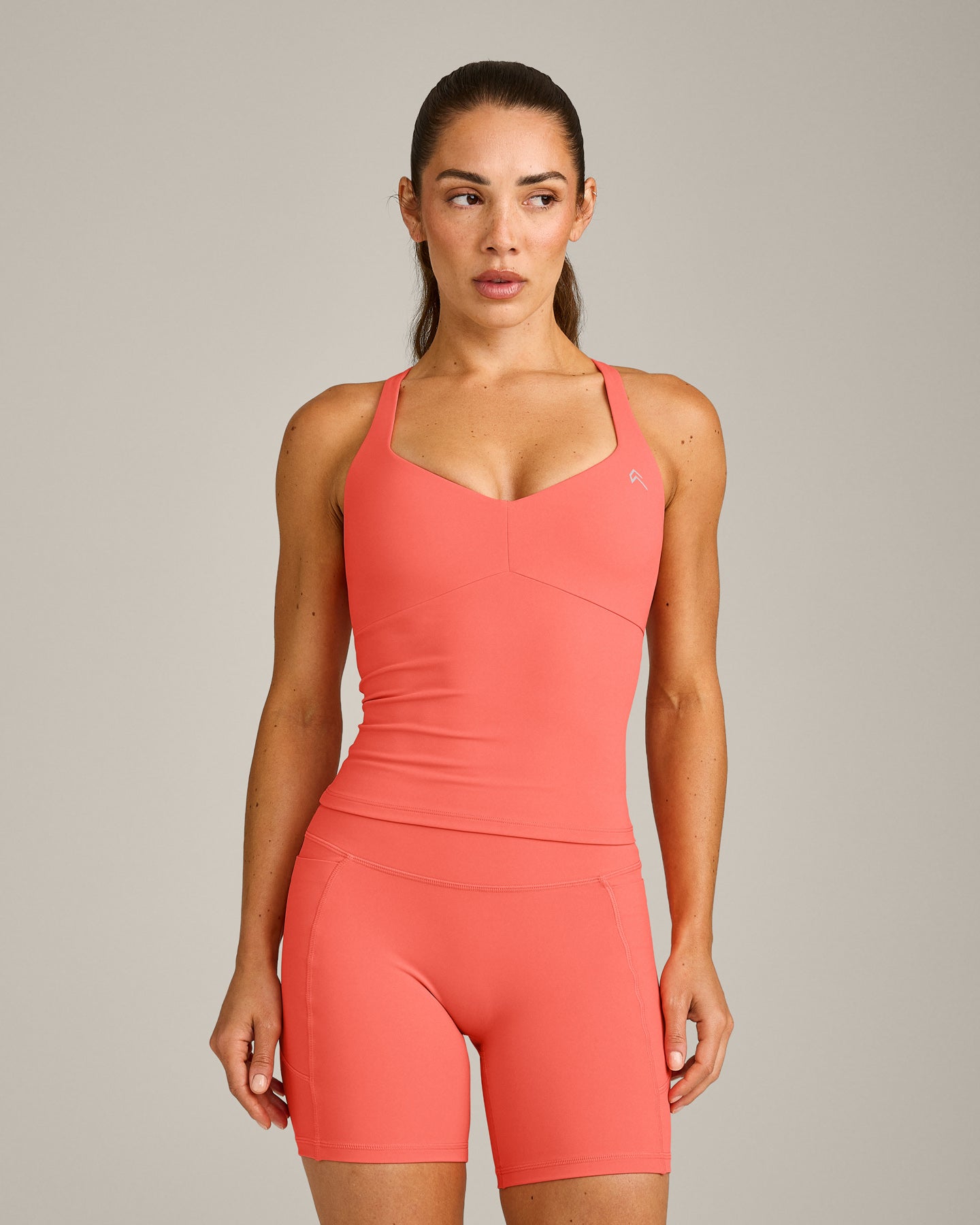 UnifiedMove T Back Mid Vest with Built in Bra Shelf with Reflective Logo | Light Charged Coral