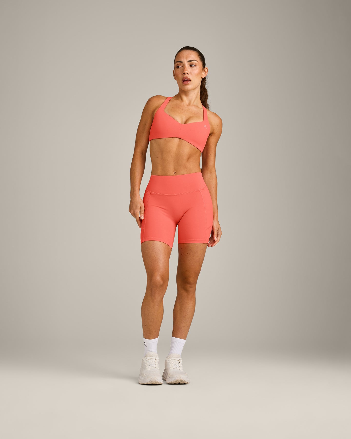 UnifiedMove T Back Minimal Bralette with Reflective Logo | Light Charged Coral - Image 3