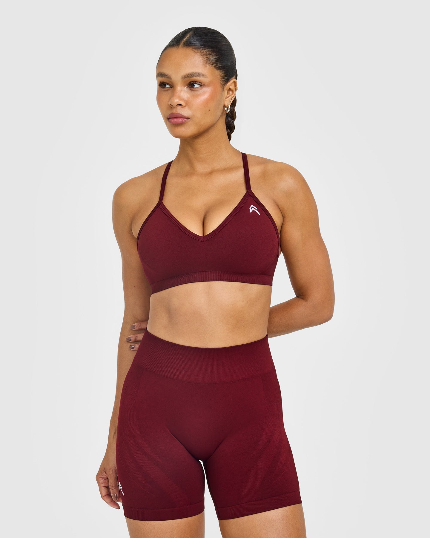 EnhanceLift Seamless Strappy Sports Bra with White Logo | Rosewood