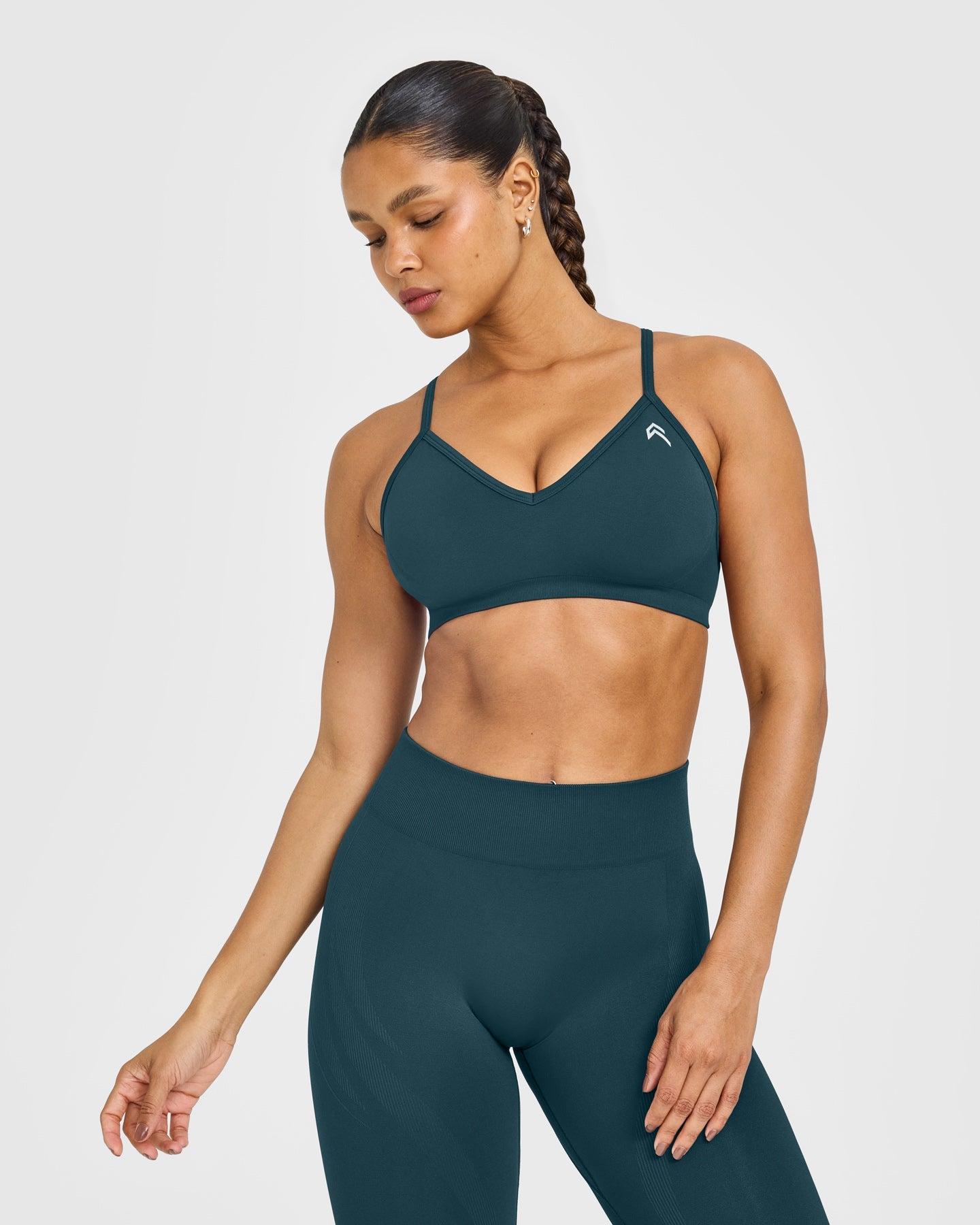 EnhanceLift Seamless Strappy Sports Bra with White Logo | Washed Oil Blue